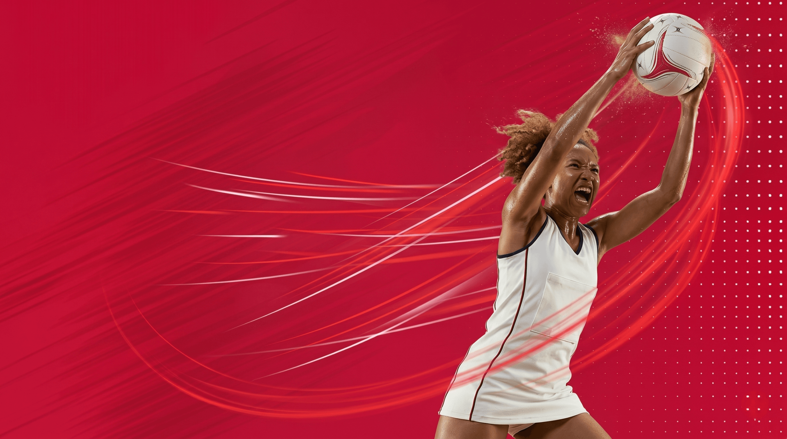 Desnic Sports | Ignite Your Performance | Sport Gear and Clothing Store | Netball player aiming with a ball for a goal
